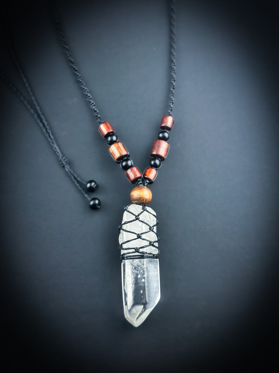 Clear Quartz point with natural rose wood beaded Necklace